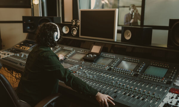 sound producer working at studio while recording song sound producer working at studio while recording song